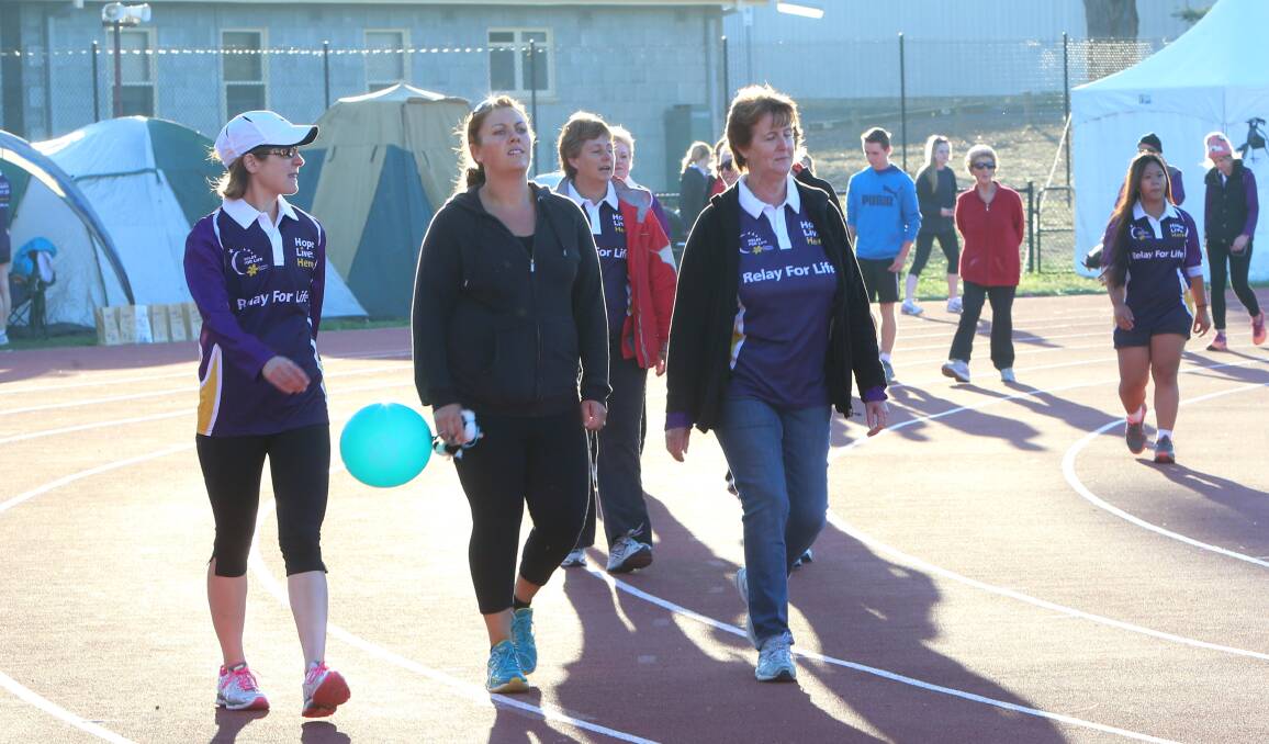 PUMPING: Relay for life teams start the new day early. Picture: PETER WEAVING