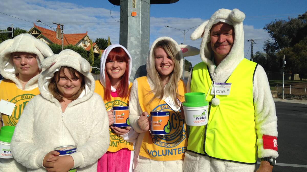 BUNNIES: Jacob Hutchinson, Holly Winslett, Elka Budge, Sam Budge, Lionel Budge shaking tins in Quarry Hill.