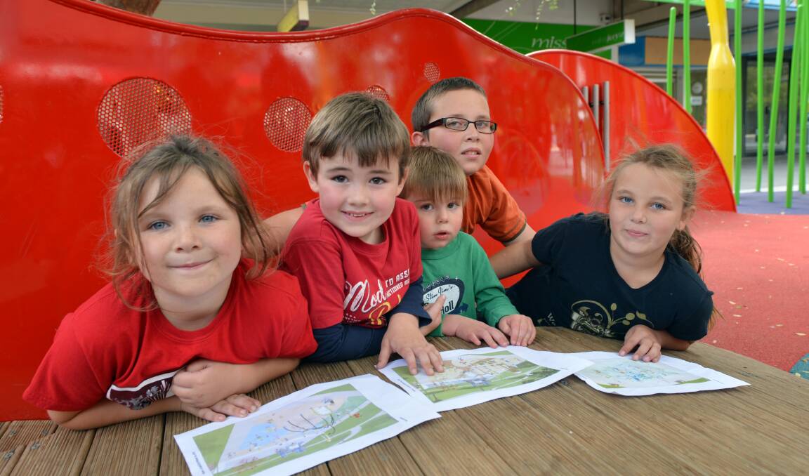 DECIDING: Brooklyn, 6, Tex, 5, Jethro, 2, Frazer, 10, and Poly, 8 look at the splash park designs. Picture: LIZ FLEMING

