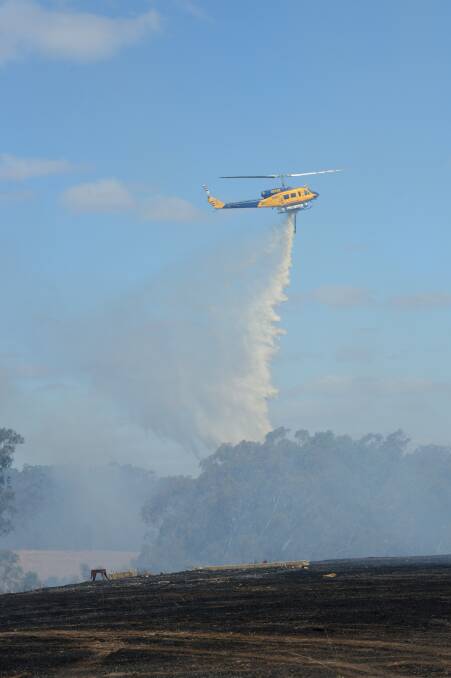 BATTLE: The CFA and air support fought the fire in Lyal yesterday. Picture: JA
