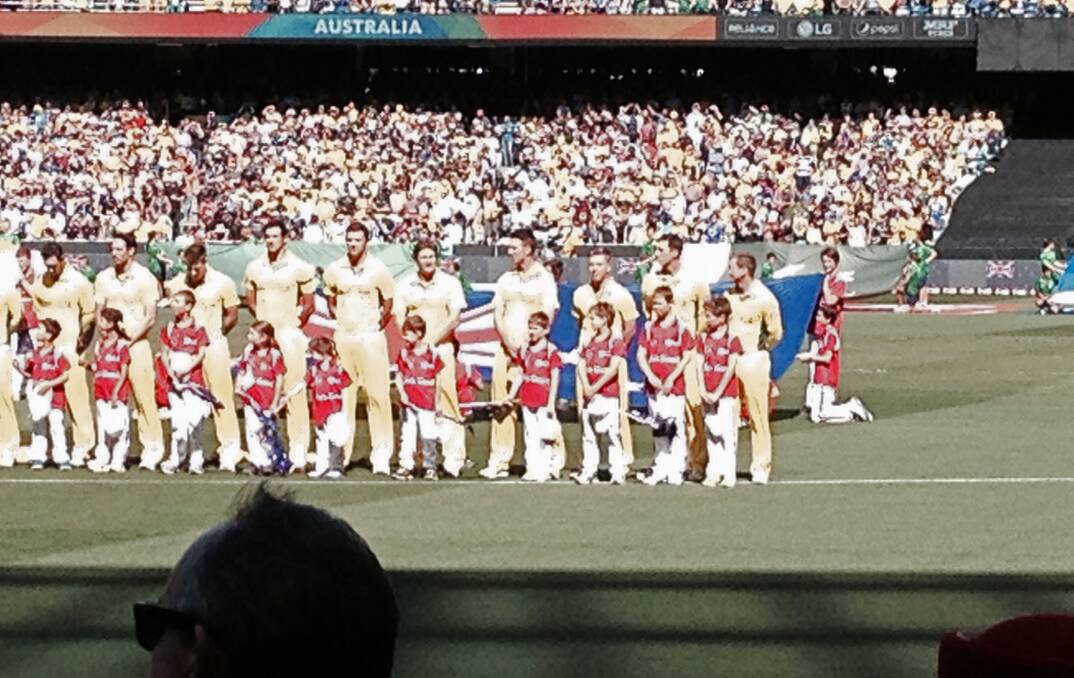 FANS: Shane Watson with Declan Pearse (fifth from the end) and Xavier Doherty with Kade Pearse (third from the end) on the MCG before the national anthems. Picture: REBECCA PEARSE