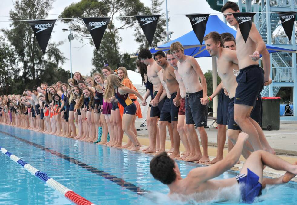 The year 12s jump in the pool at the end of the day. 