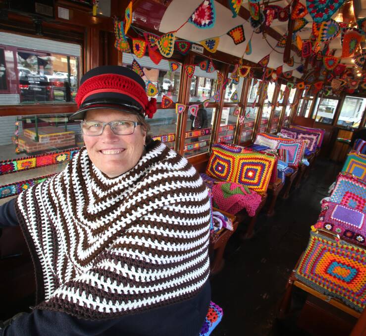 COLOURFUL: Tram driver Julie Cain said the tram's new decor was brilliant and got into the spirit by wearing a woollen shawl. Picture: PETER WEAVING