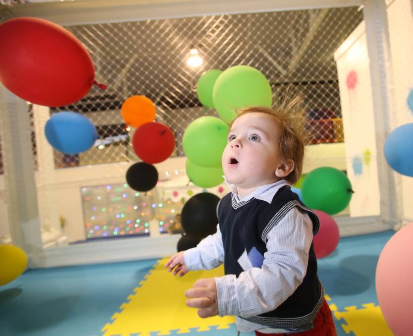 FUN AND GAMES: Oliver Dawborn, 16 months, plays in the balloon room at Mulligrubs in Bendigo. Picture: GLENN DANIELS