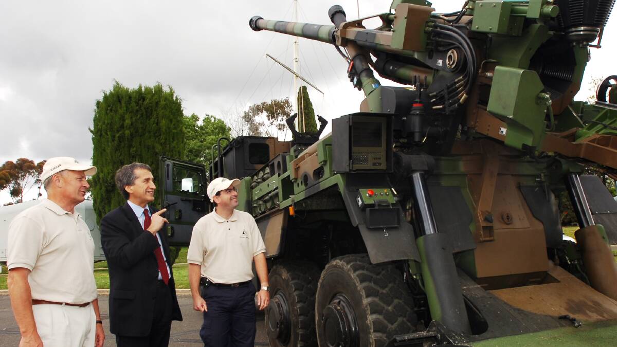from left- Neville Humphry, Leigh Funston and Olivier Jonquet with the French Field Gun while it was parked at the Bendigo ADI factory.
pic by Andrew Perryman on Tue 25th Oct 2005.