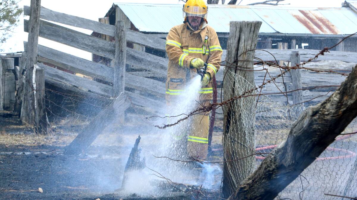 MOPPING-UP: At Laanecoorie in a grass and structure fire. Picture:  PETER WEAVING