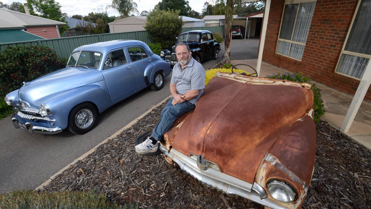Rick Kingsley with his Blue FJ Holden and Black FX Holden.
Picture: JIM ALDERSEY