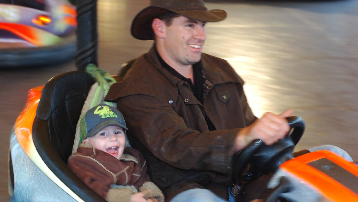 Chris and Dylan Dowler enjoying the dodgems at the Castlemaine show.
pic by Bill Conroy 29/10/05