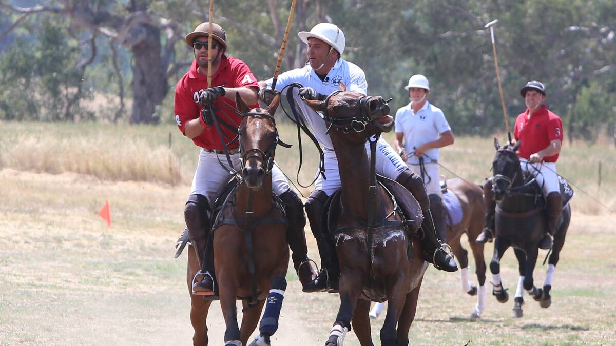 For the first time in Bendigo a polo match was played at Chateau Dore. Players from across Australia and England.
Ant Morrell being pushed by Paul Banks
Photo Peter Weaving 150213