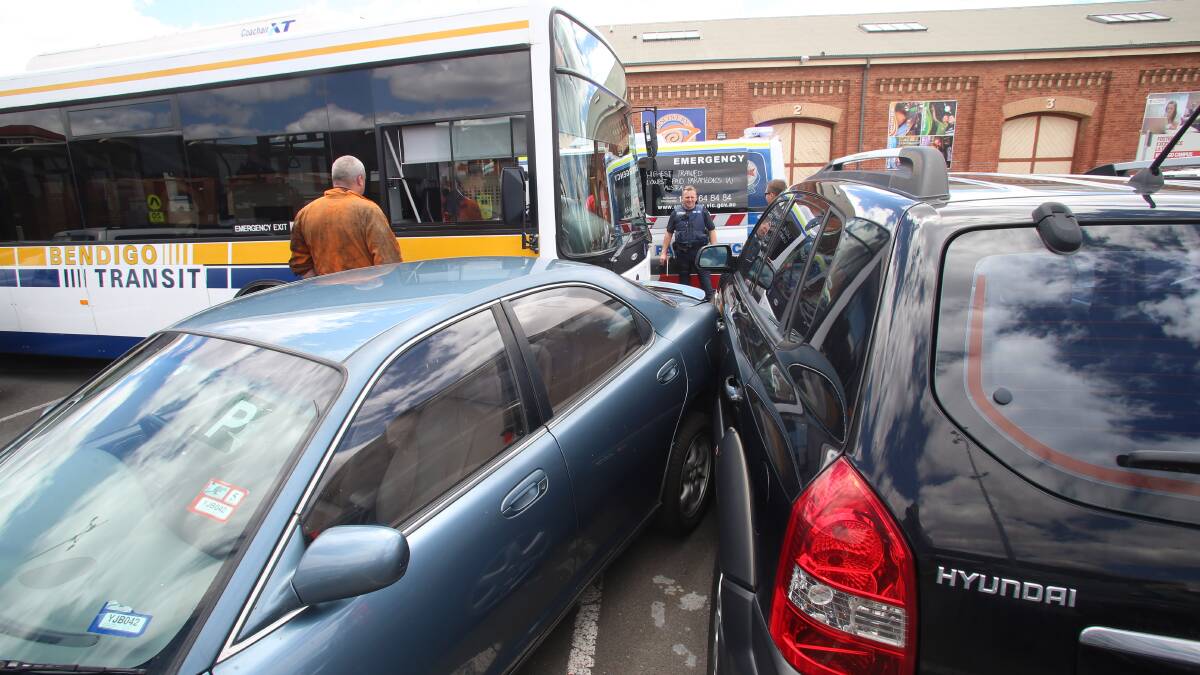 Bus crashed into two cars in railway station carpark.
Picture: PETER WEAVING