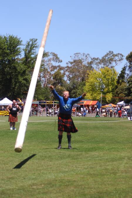 Will Binks from Moolop competes in the Caber Tossing at the 145th Maryborough Highland Gathering
pic: Bill Conroy 2/1/06