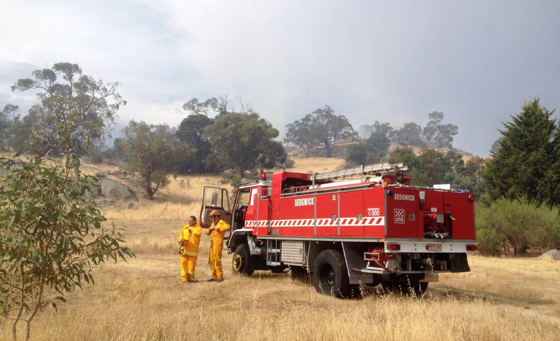 CFA crews on the scene of the fire at Harcourt North. Picture: JIM ALDERSEY