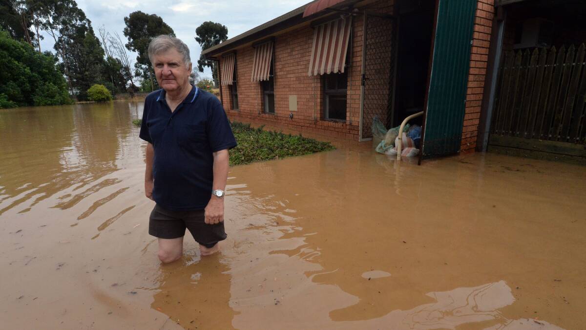 DAMAGE: Laurie Fitzgerald leave his flooded unit at Eaglehawk. Picture: BRENDAN McCARTHY
