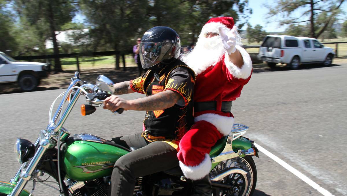 Santa arriving in Mumbil with the Bandidos earlier that day to give toys and lollies to local children.