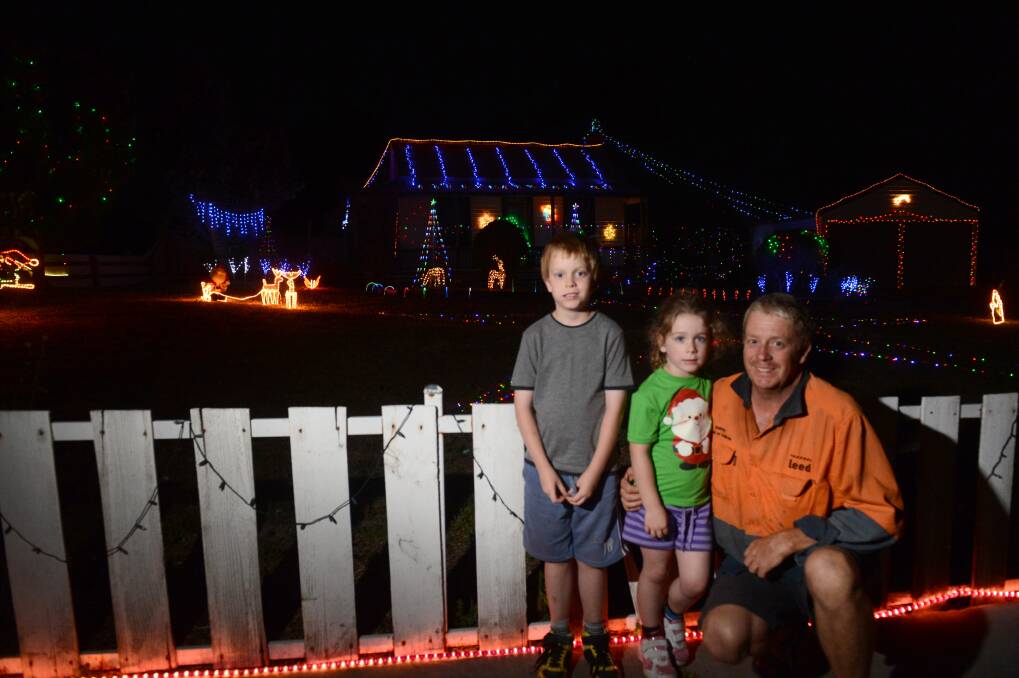 Christmas Lights, Nicholas, 7, and Ava, 4, and Paul Armitage.
Picture: JIM ALDERSEY