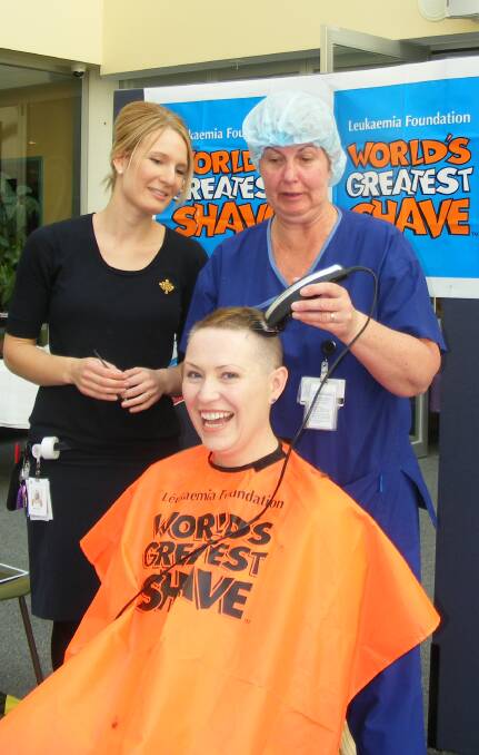 CLIP: St John of God Hospital theatre manager Denise Leech shaves Naomi Fayers' head.