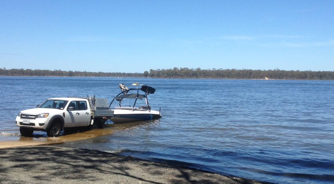 A woman has been burnt after a boat caught fire on Lake Eppalock.