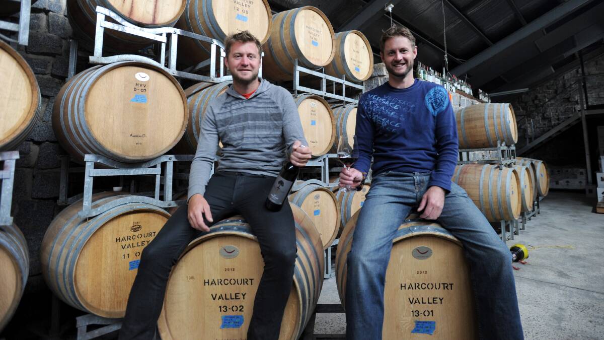 WIN: Quinn and Kye Livingstone of Harcourt Valley Vineyard with their wine. Picture: JODIE DONNELLAN 