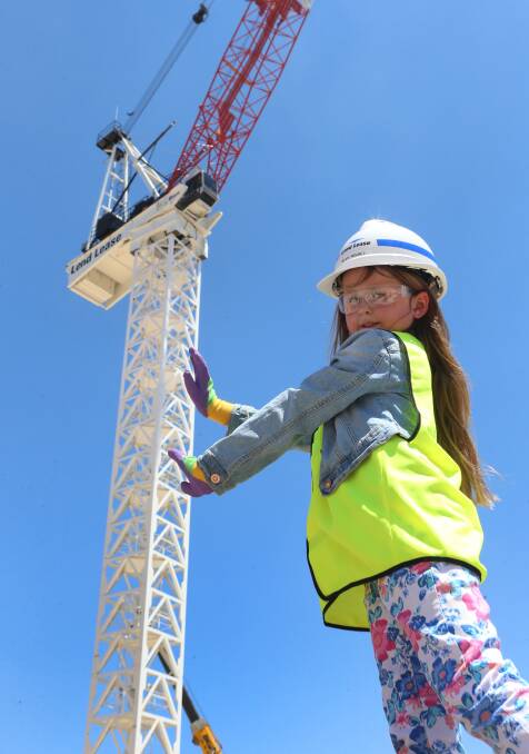 BIG BEN: Neve Nisbet and the crane she named Ben. Picture: PETER WEAVING