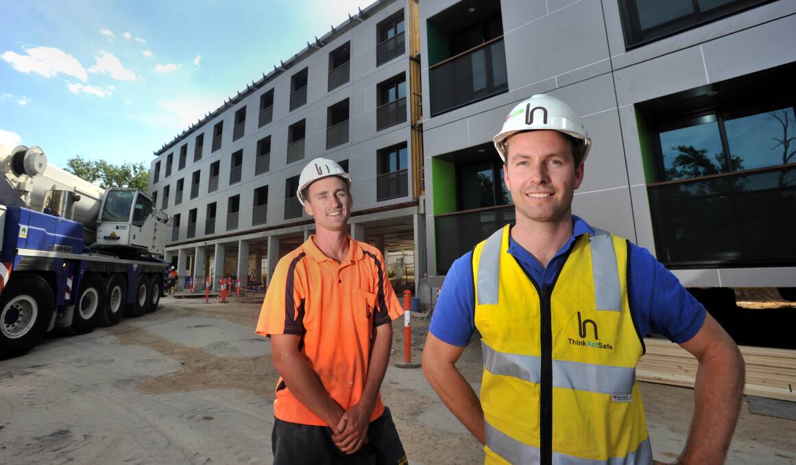 FAST WORK: Site manager Jono Frost and project manager Travis Budd at the new hotel. Picture: JODIE DONNELLAN 
