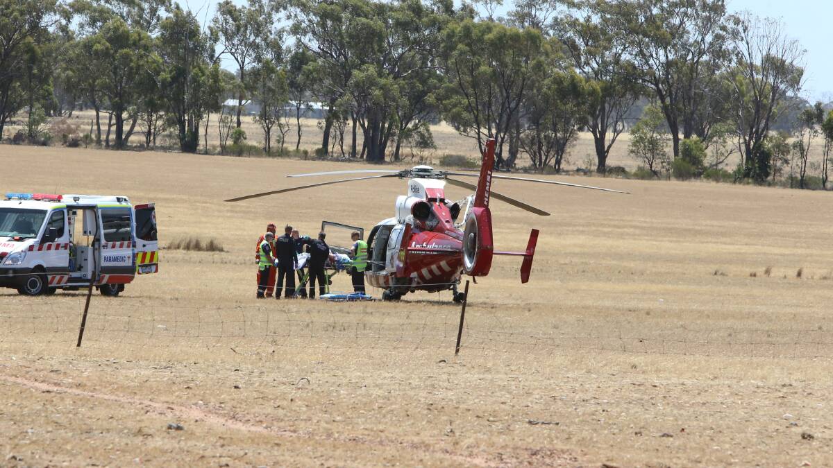 DOUBLE FATALITY: A patient is transported to hospital by helicopter. Picture: LIZ FLEMING