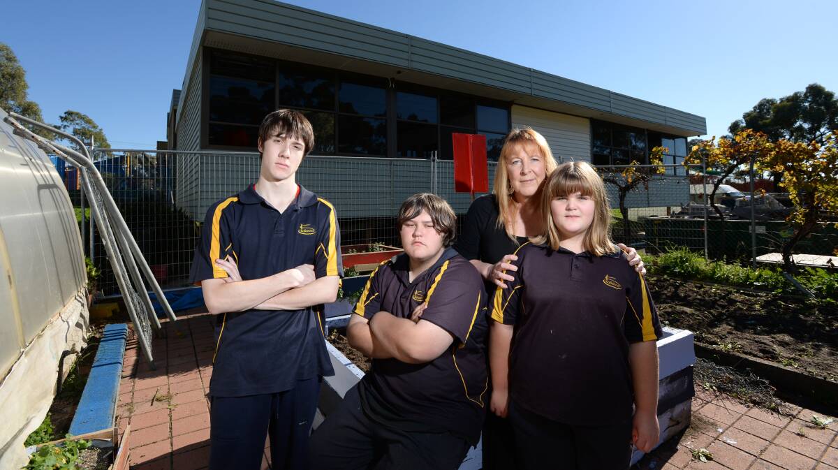DISAPPOINTED: Kalianna Special School students Tully M, Christian D, school council member Gail Hardy and student Caity H in the school's horticulture area, in front of the portable classroom. Picture: JIM ALDERSEY