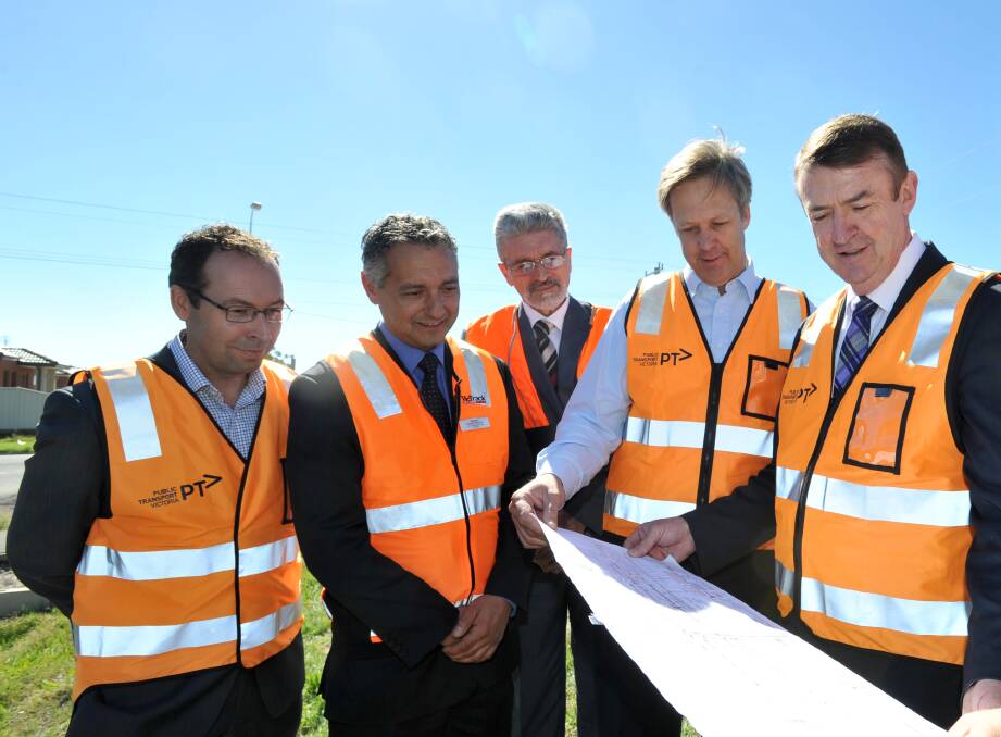 EPSOM: Viewing construction plans back in April - Troy O'Sullivan of Public Transport Victoria, Andrew Kyriacou and Dragan Dasic of VicTrack, Greg Bickley and Terry Mulder. Picture: JODIE DONNELLAN