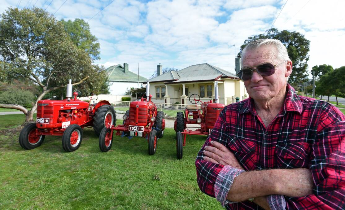 PROUD: Bill Tuohey, 74, with his restored vintage tractors. Picture: JODIE DONNELLAN