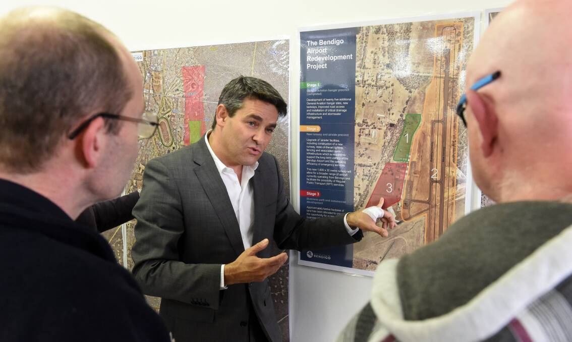 PLAN: Stan Liacos explains the plans for a new runway to residents who attended a meeting at the airport on Tuesday. 