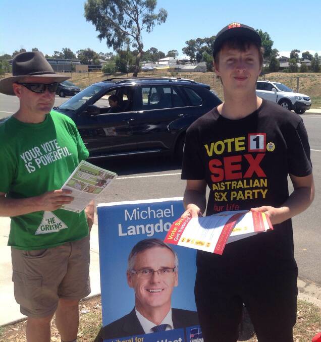 MOTLEY CREW: Charlie Crutchfield, flanked by Michael Langdon (in billboard form) and the Greens' John Brownstein. 