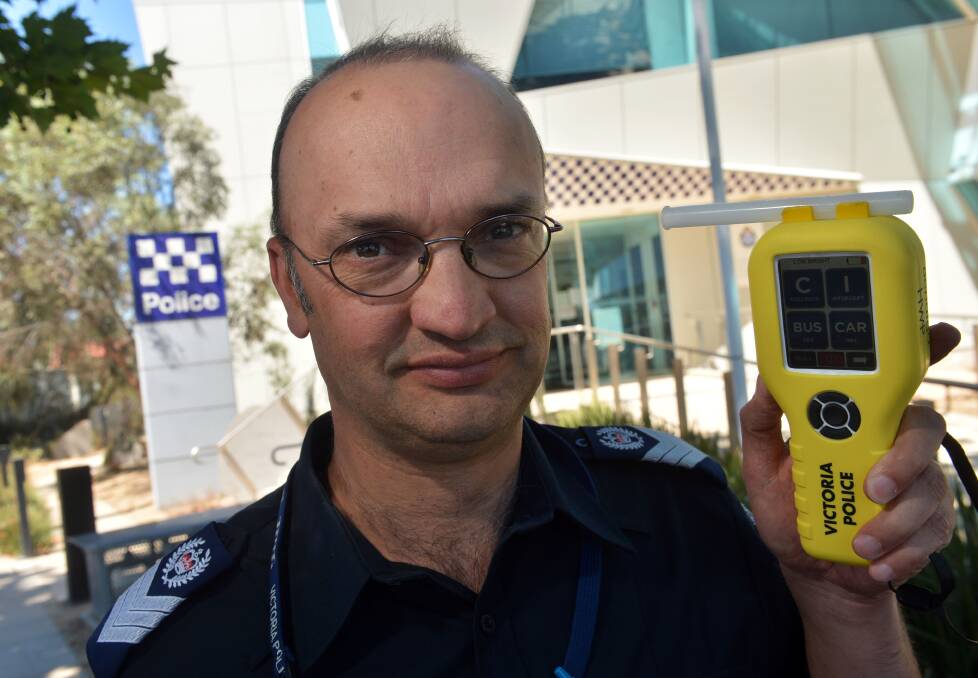 WARNING: Senior Sergeant Craig Gaffee with a breathalyser. Police will be out in force for New Year's Eve to target drink and drug-drivers as well as antisocial behaviour. Picture: BRENDAN McCARTHY