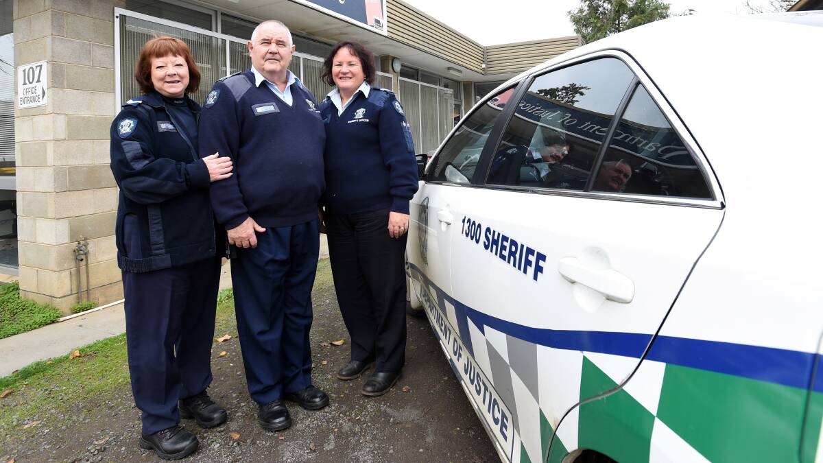 TEAM: Senior sheriff's officers Kathryn Feeney, George Griffiths and Michelle Stewart. Picture: JODIE DONNELLAN 