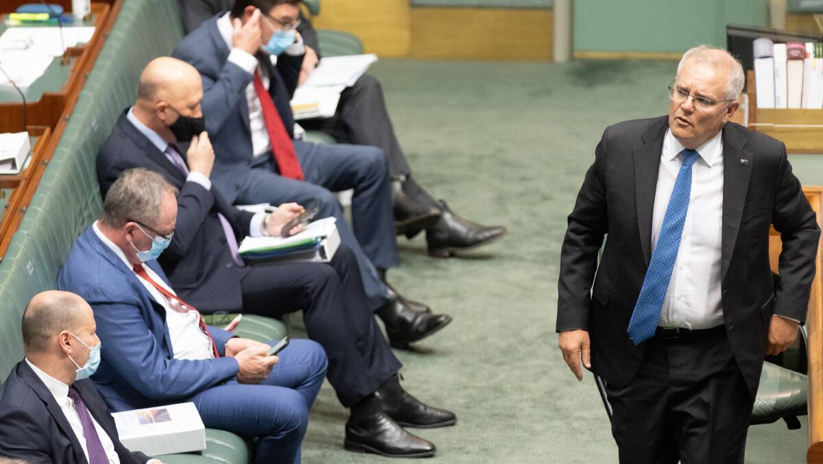 Prime Minister Scott Morrison (right) and the Coalition frontbench. Picture: Sitthixay Ditthavong