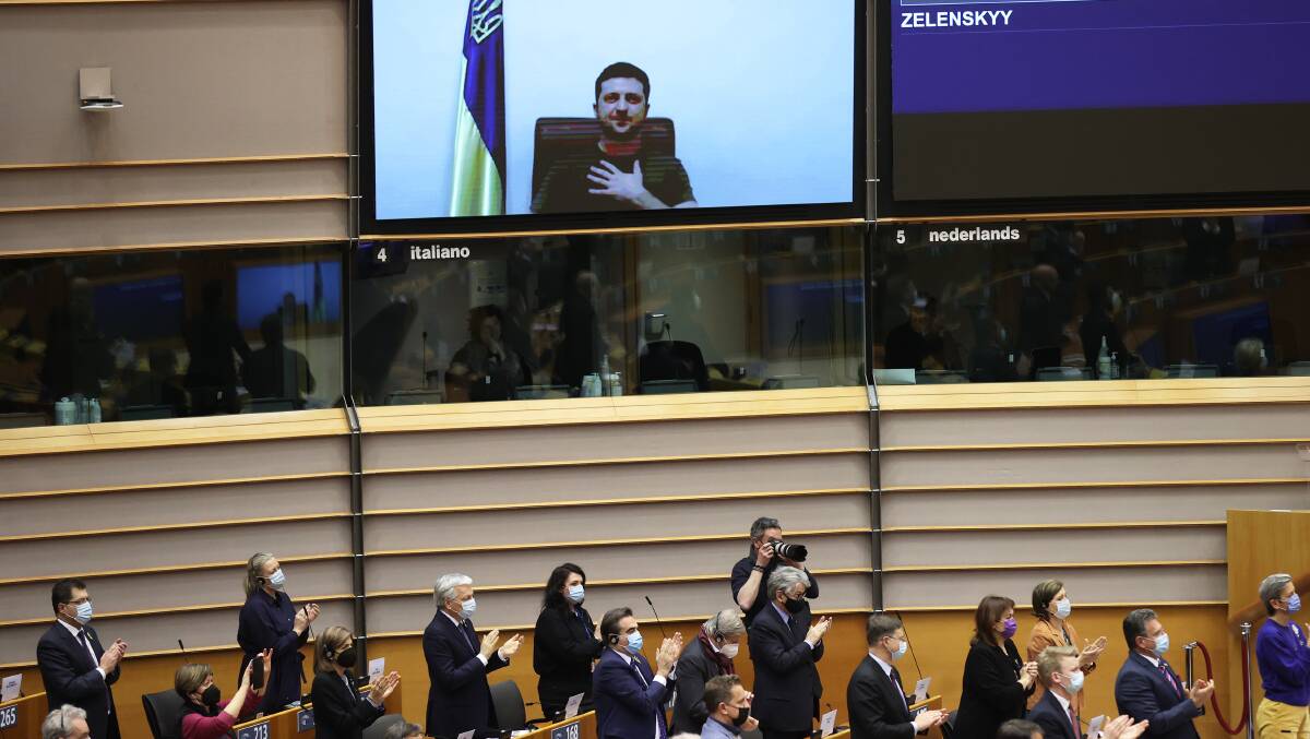 Volodymyr Zelensky addresses the European Parliament in Brussels from Kyiv on Tuesday. Picture: Getty Images