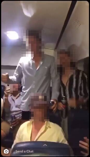 The Snapchat video shows two boys, pictured in the grey and striped shirts, leading a degrading chant about women. Picture: SUPPLIED
