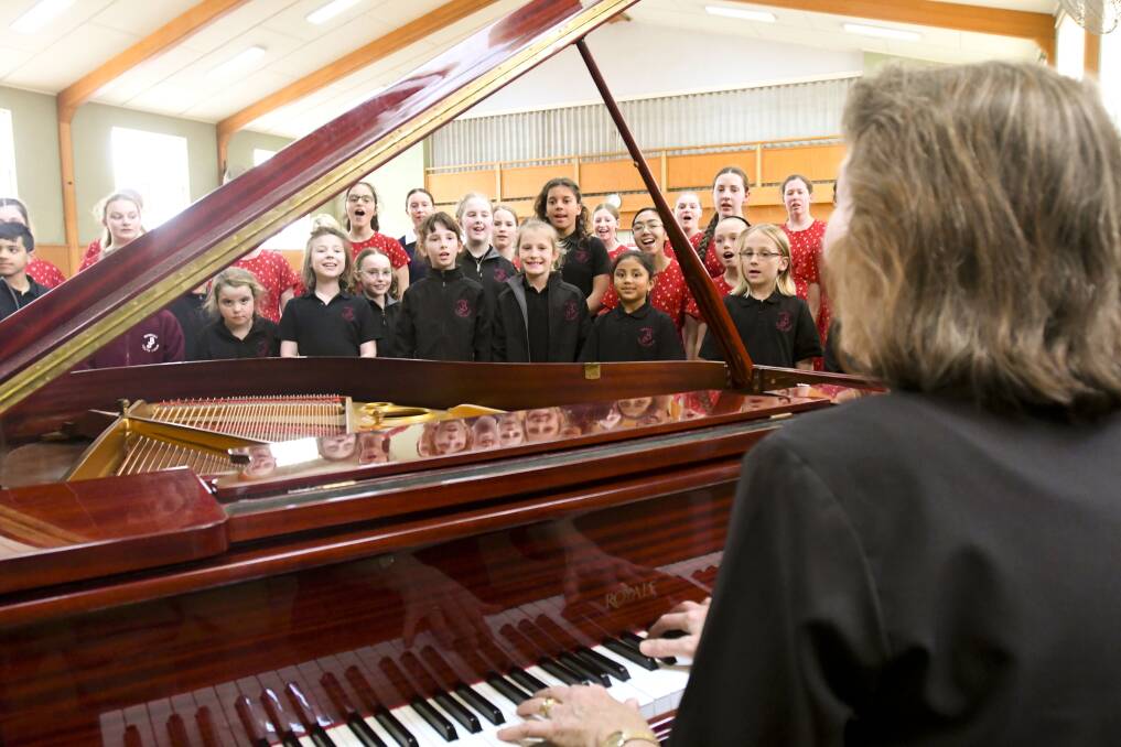 The Bendigo Youth Choir rehearses for the 35th anniversary celebrations. Picture: NONI HYETT
