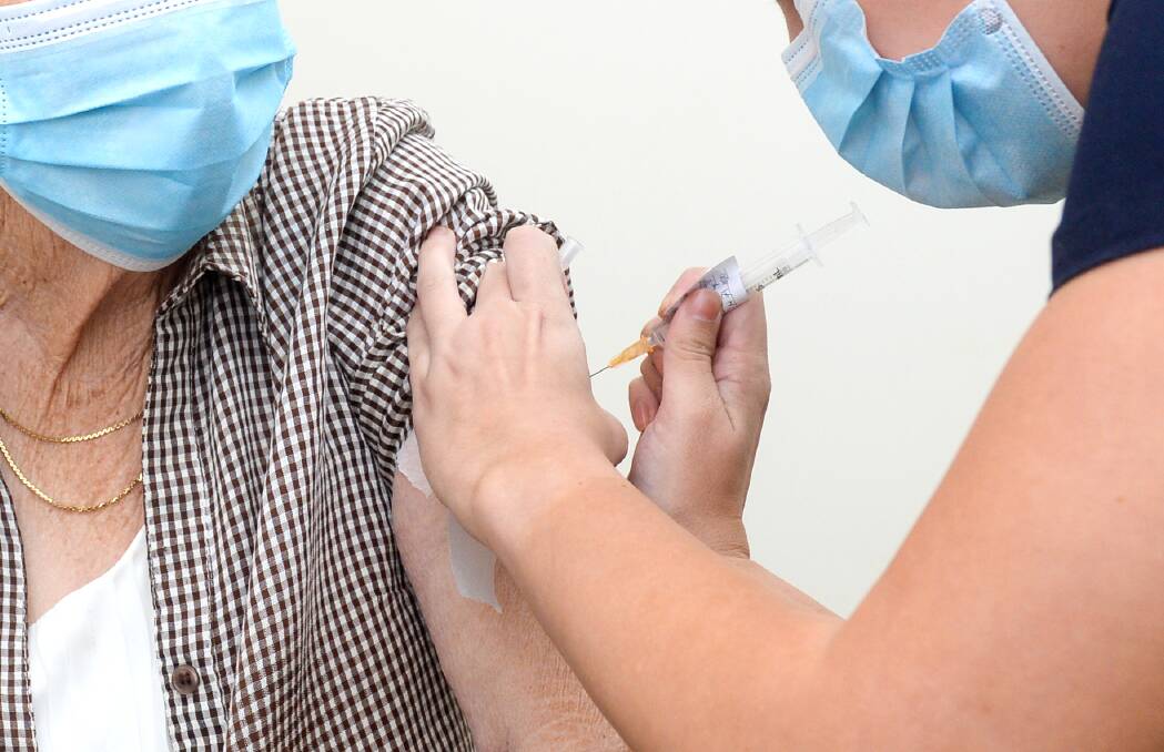 Bendigo resident being vaccinated. Picture: DARREN HOWE