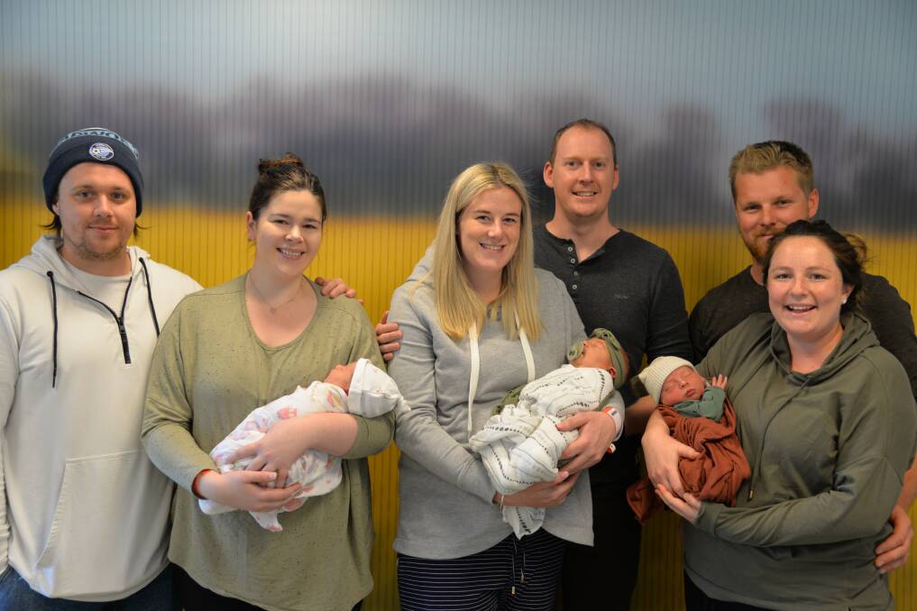 SPECIAL DAY: (from left) Katelyn Carassiti with partner Scott and daughter Lottie, Ellie O'Mahoney with partner Jordan and daughter Willow, and Matilda Viergever with partner Jason and son Archie. Picture: SUPPLIED
