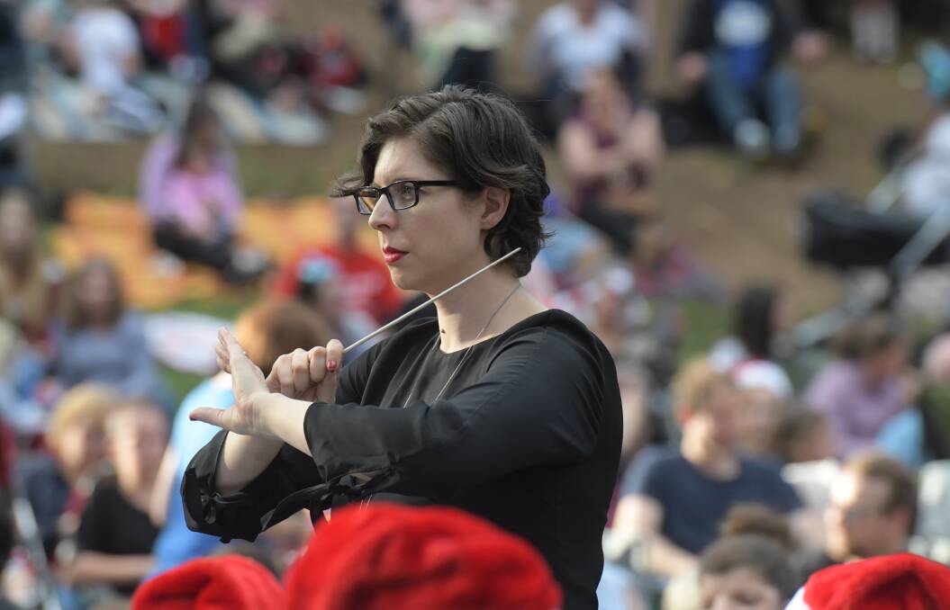 Cally Bartlett conducting at Bendigo's Carols by Candlelight in 2019. Picture: NONI HYETT