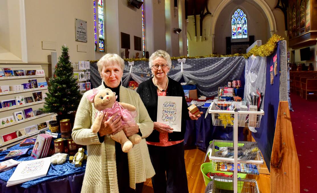 JOY: Barbara Simpson and Judith McCarthy at the St Paul's Cathedral Christmas Shop in 2019. Picture: BRENDAN MCCARTHY 