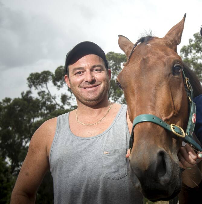 Trainer Scott Dyer with his horse The Boss Man in 2016. Picture: DARREN HOWE