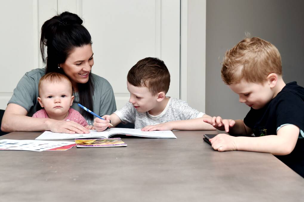 Hayley Kellow with her six-year-old son Louis, four-year-old son Billy and baby daughter Isla. Picture: DARREN HOWE