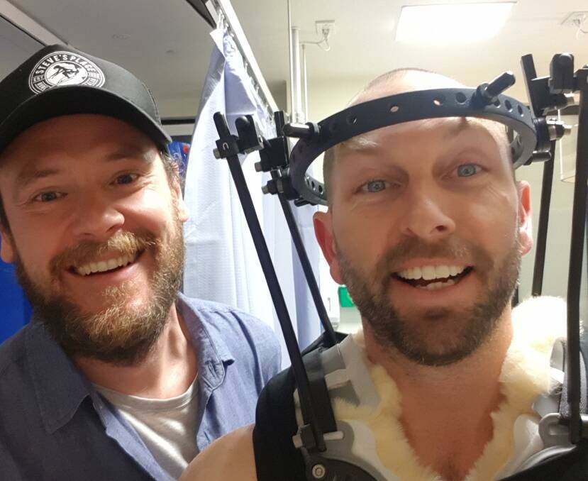 SUPPORT: Damien Wells with a high school friend while recovering in the Royal Melbourne Hospital. Picture: SUPPLIED