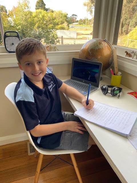 PERKS: Miller Polglase has been enjoying remote learning - especially maths classes with his dad. Picture: SUPPLIED