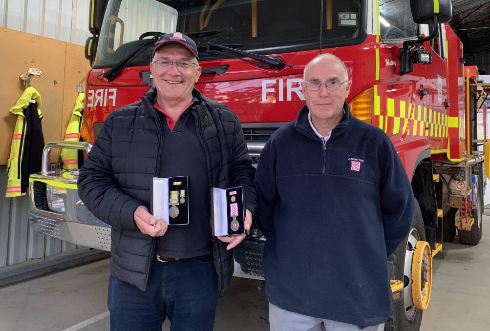 HONOUR: Junortoun firefighters Mark Zulian and Ray Mundy received National Emergency Medals for their efforts on Black Saturday. Picture: TARA COSOLETO