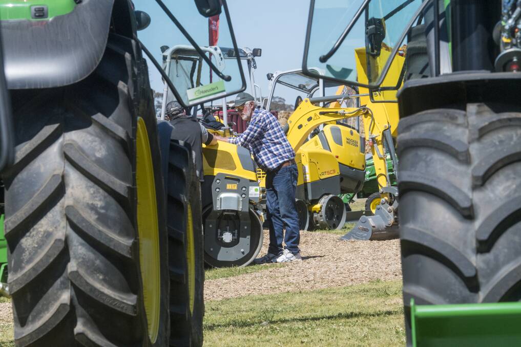 TECHNOLOGY: Farmers assessed the new equipment at the agriculture event on Tuesday. Picture: DARREN HOWE 