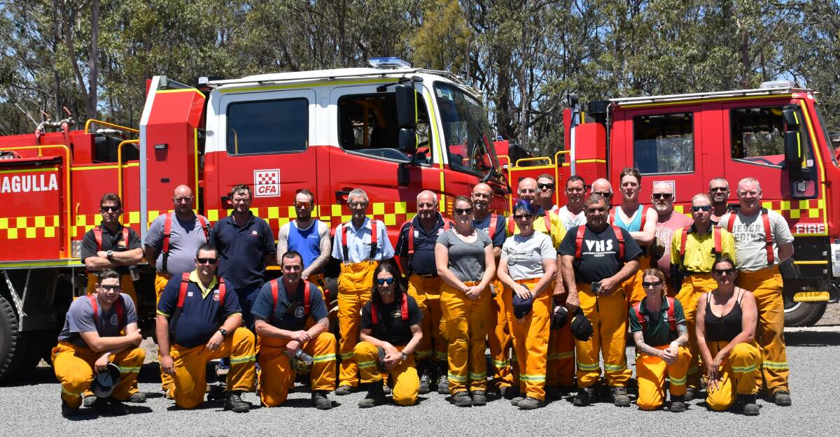 VISITING THE VALLEY: The CFA's 2092 strike team, made up of five fire trucks from nine Victorian based brigades, pictured at the Hunter Valley RFS headquarters near Bulga.
