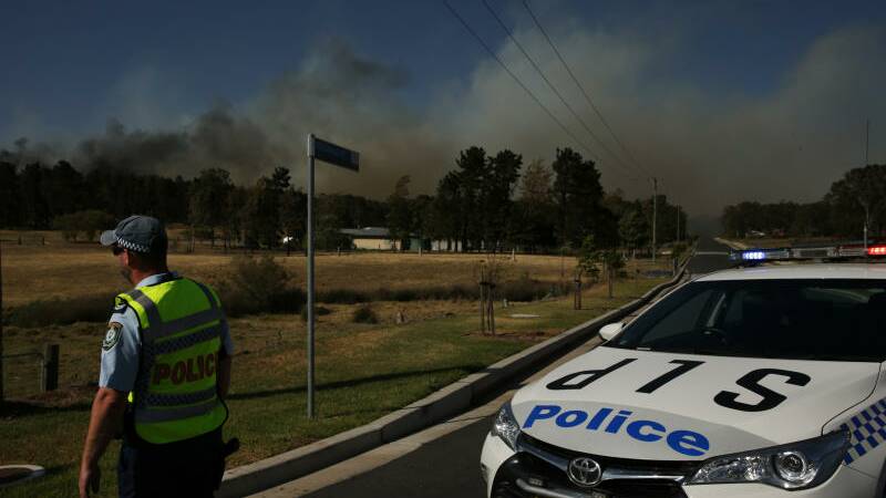 ROADSIDE: Images from the Greta bushfire on Tuesday afternoon.