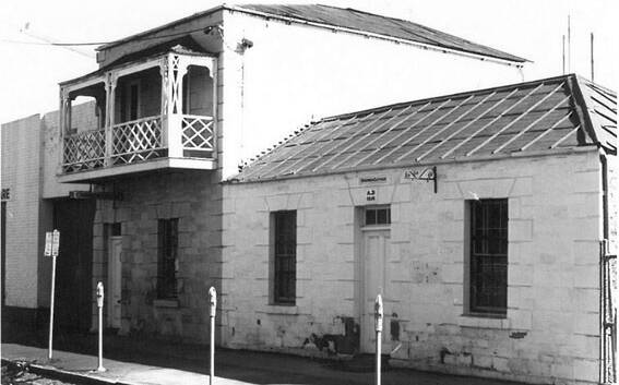 HISTORY: Specimen Cottage, painted white, before a restoration in the 1970s. The cottage is now the display centre for the historical society.