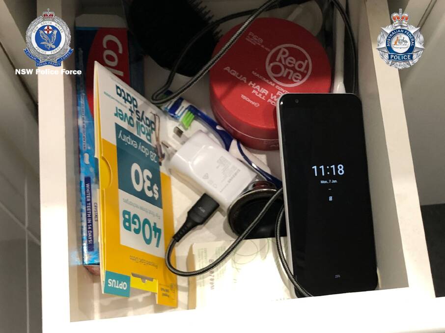 The encrypted phone allegedly discovered during a raid on Mr Clark's home. Photo: NSW Police